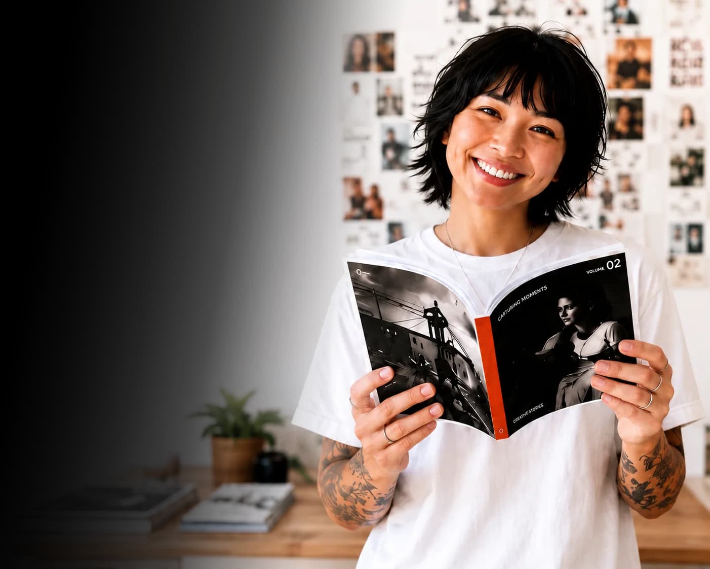 A zine maker smiling while holding a finished, hand-bound zine